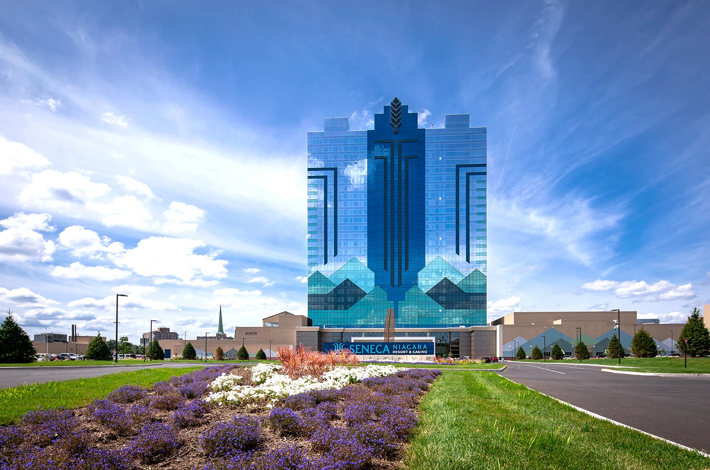 Exterior shot of the casino with clouds behind it.